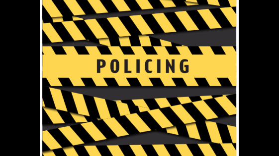napis Policing na czarno-żółtym tle